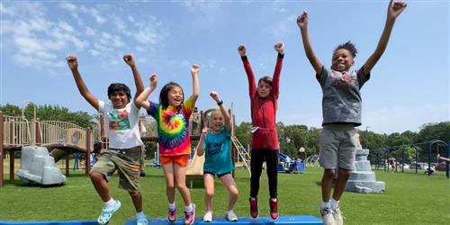 kids jumping on playground